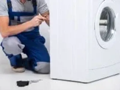 Electrician installing a washing machine