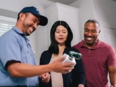 Mr electric technician showing a product to client.