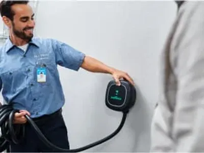 Electrician holding wallbox