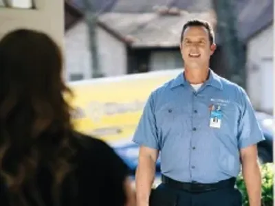 Mr. electric technician talking to a customer.