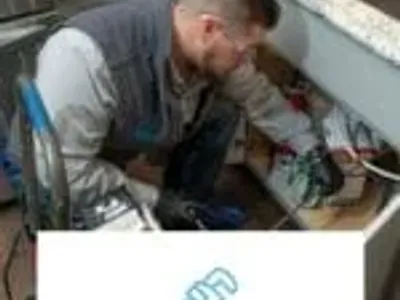 man fixing problem plumbing
