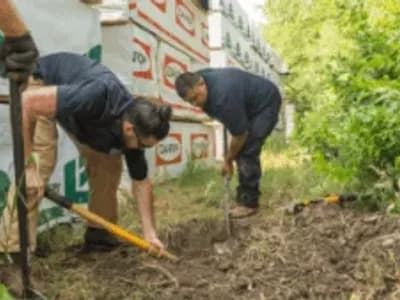 workers detecting leak and repairing it