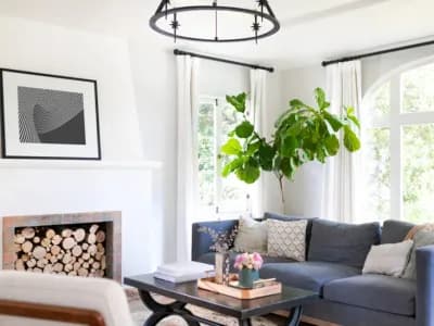 fireplace in white living room blue couch