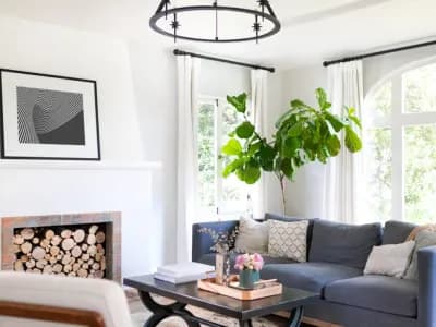 fireplace in white living room blue couch