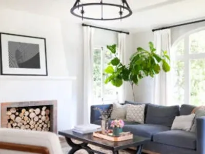 fireplace in white living room blue couch
