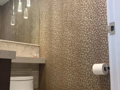 Precision Painting Plus commercial interior bathroom wallpaper installation