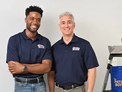 Two technicians standing next to eachother