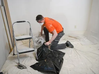 Worker cleaning up after project