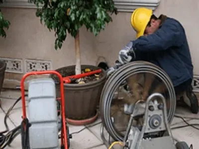 Plumber Performing Rooter Services