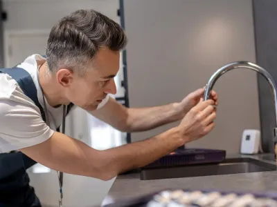 Plumber Installing Faucet