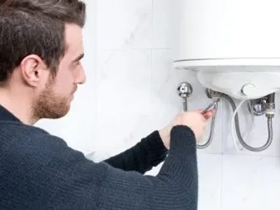 Plumber With A Hot Water Heater