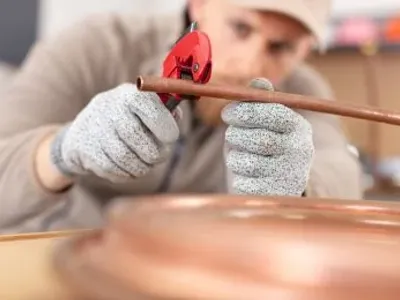Plumber With Copper Pipe