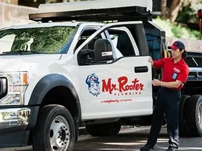 Mr. Rooter Plumbing white work truck.