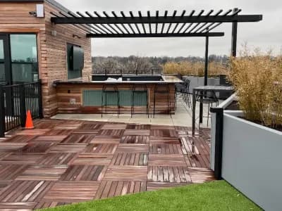 Stone retaining wall with lighting fixtures in Elmsford, NY.