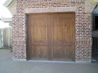 Unpainted wooden garage doors