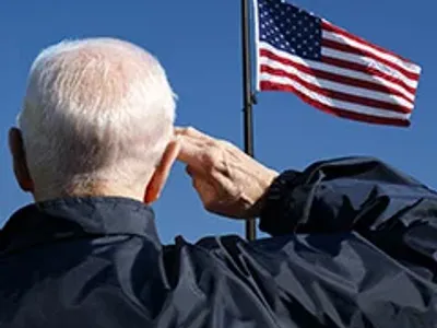 Man saluting flag