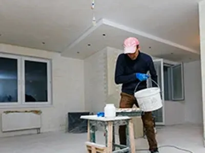 Team member pouring paint