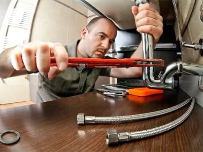 portrait of caucasian plumber at work