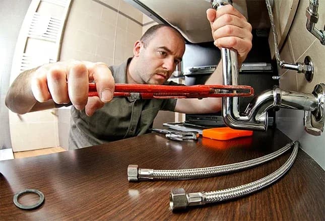 portrait of caucasian plumber at work
