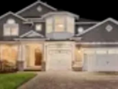 A two-story house with a garage.