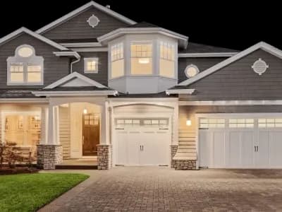 A two-story house with a garage.