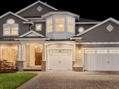 A two-story house with a garage.