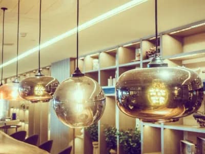Hanging decorative pendant lights with warm illumination, enhancing kitchen ambiance and showcasing modern design elements.