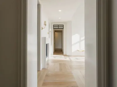 hallway with open door at the end by 10x builders in utah county