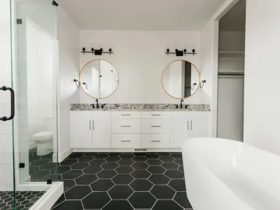 double bathroom vanity with black & white tile by 10x builders in utah county