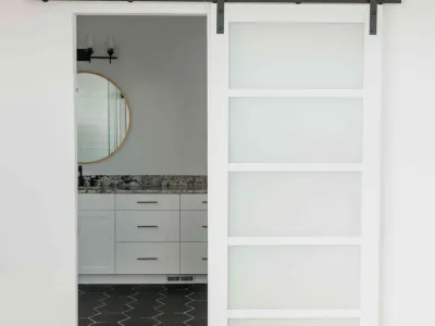 white bathroom barn door by 10x builders in utah county