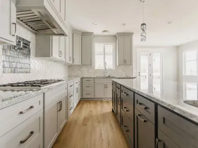 kitchen with cream & gray cabinets with light flooring by 10x builders in utah county
