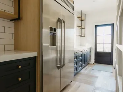 kitchen fridge with dark cabinets by 10x builders in utah county