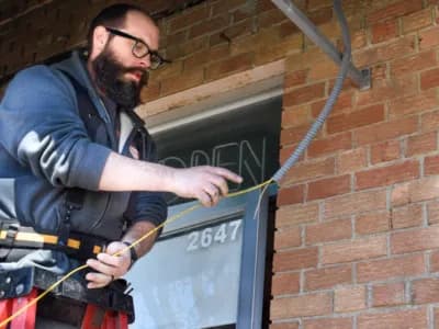 Electrician running cables