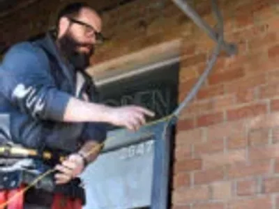 Electrician running cables