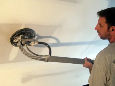 drywall contractor with sander