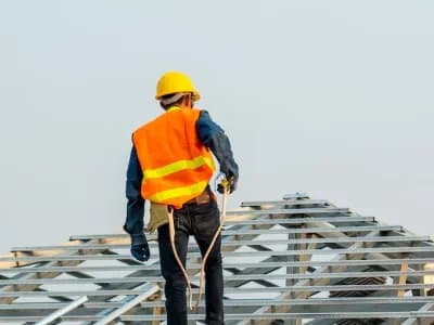 man working on roof