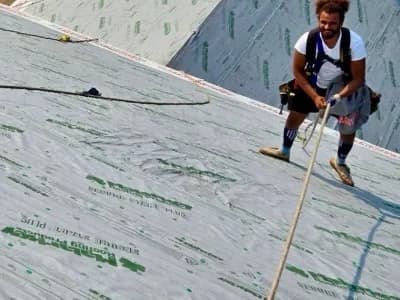 man installing roof