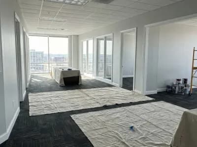 Freshly painted modern commercial office interior with light gray walls and white trim in Nashville, TN