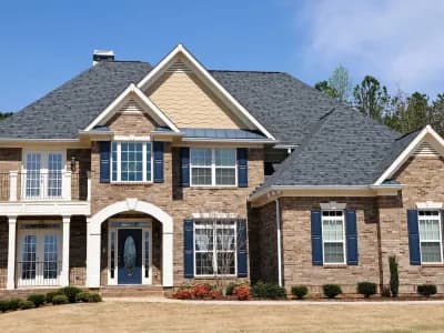 replacement windows in a two story brick home