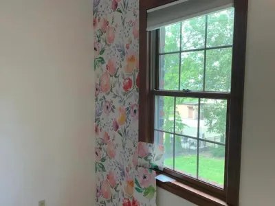 We added some decorative wallpaper to this residential home's bedroom.