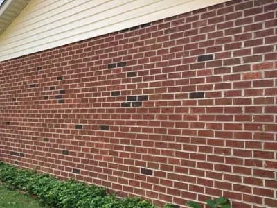 An exterior siding painting project for a residential home using our air-assisted sprayer.