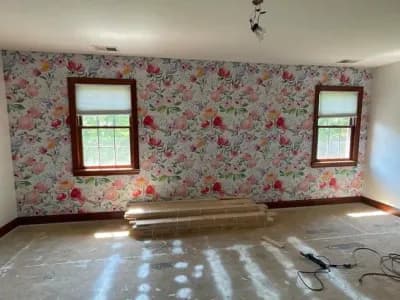 We added some decorative wallpaper to this residential home's bedroom. Here's the finished product of the wallpaper around the windows and wall.