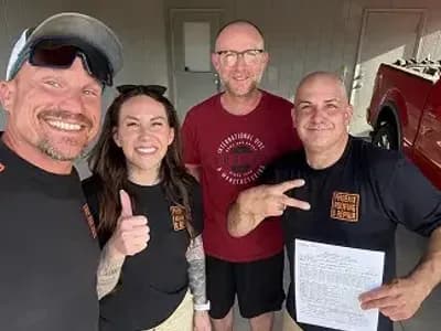 roofing expert team with a happy client