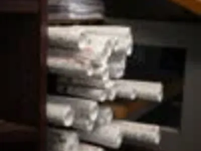 Stacked electrical project plans at Cascade Electric in Tucson, Arizona
