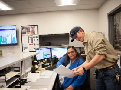 Commercial electricians reviewing their electrical installation project schedule