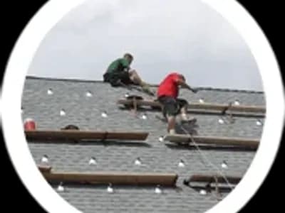 Men doing roof repair