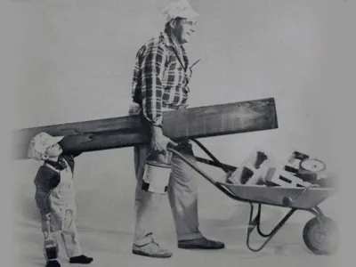 Mr. Wiese With his son moving painting equipment.