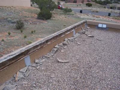 removal of loose stucco on home foundation