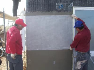 men reinforcing the structure of a home