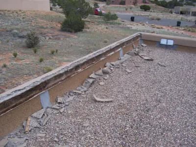 removal of loose stucco on home foundation